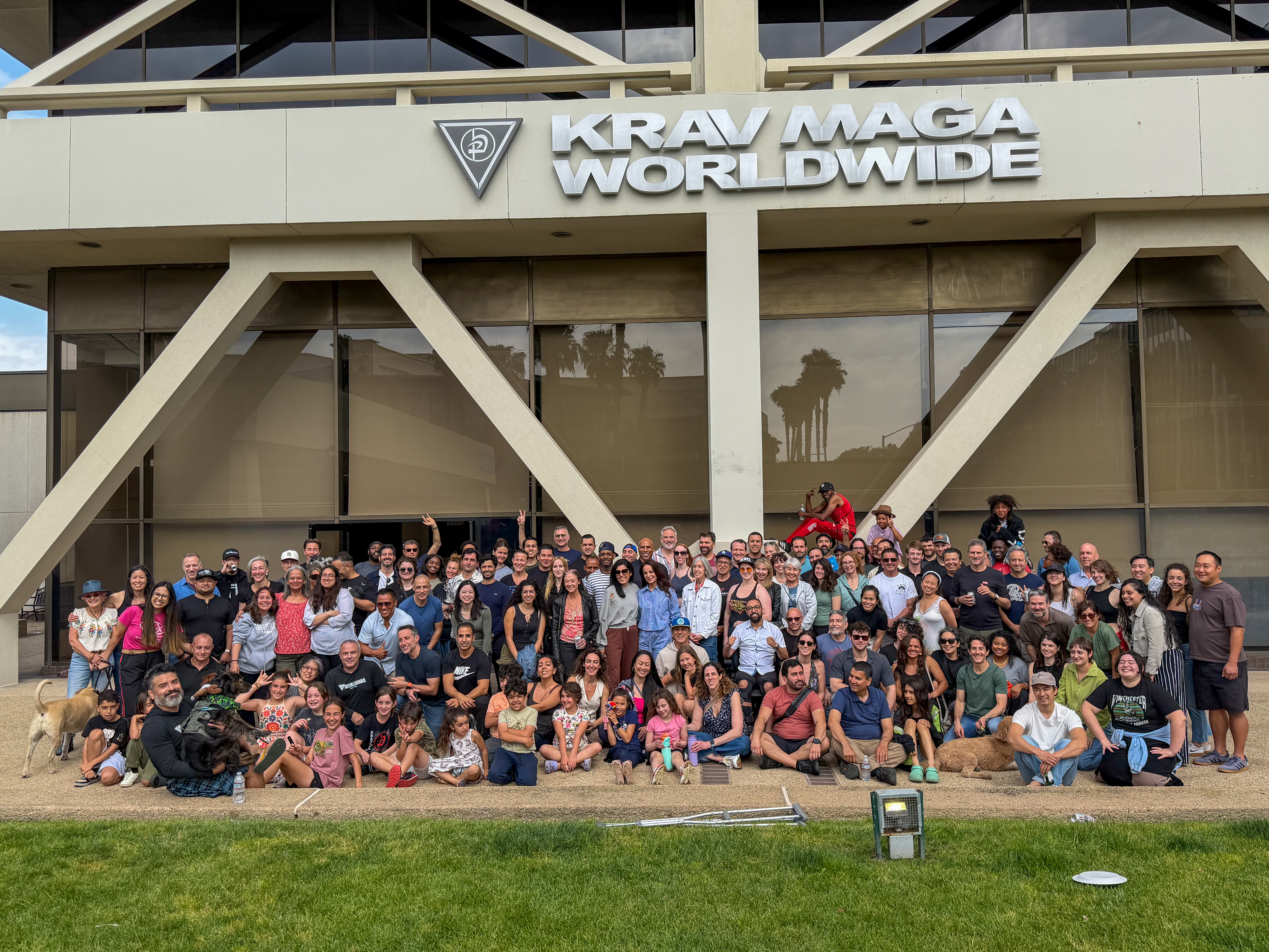 KLR Community in front of KMW Sign